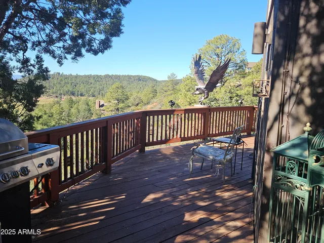 a view of a balcony with wooden floor
