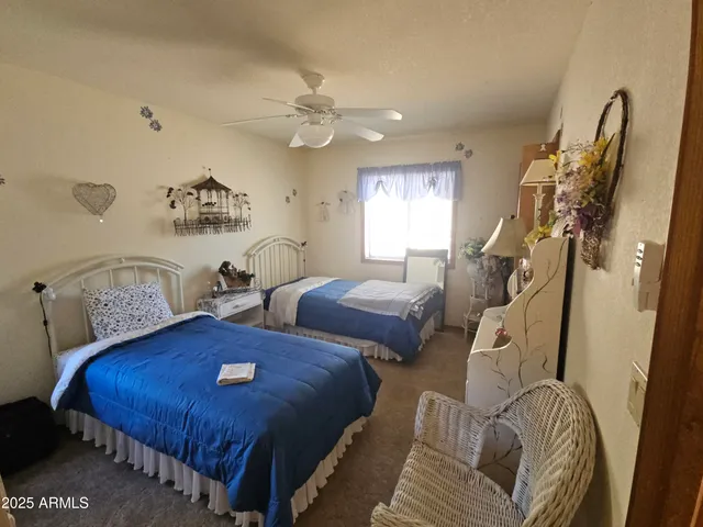 a bedroom with furniture and a window