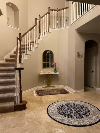 a view of a living room and entryway