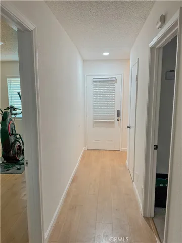 an aerial view of a multi story residential apartment building with yard and green space