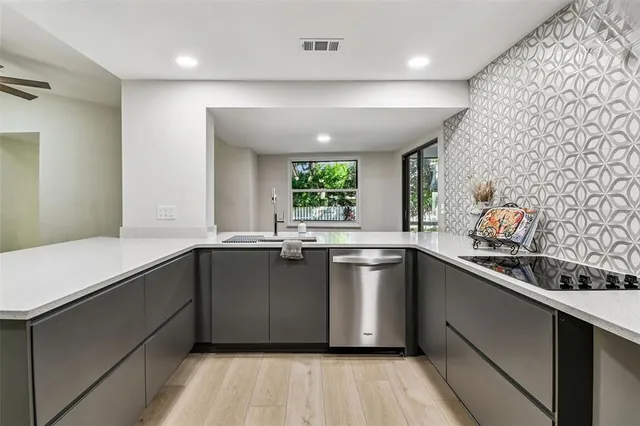 a view of a dining room with furniture and a potted plant