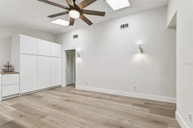 a bathroom with a granite countertop sink vanity and mirror