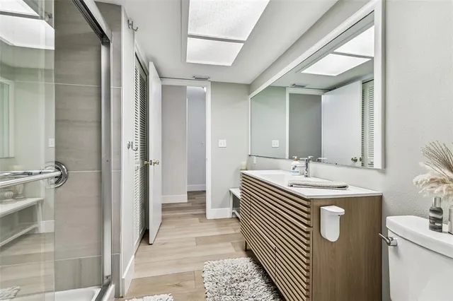 an aerial view of a house with a yard and lake view