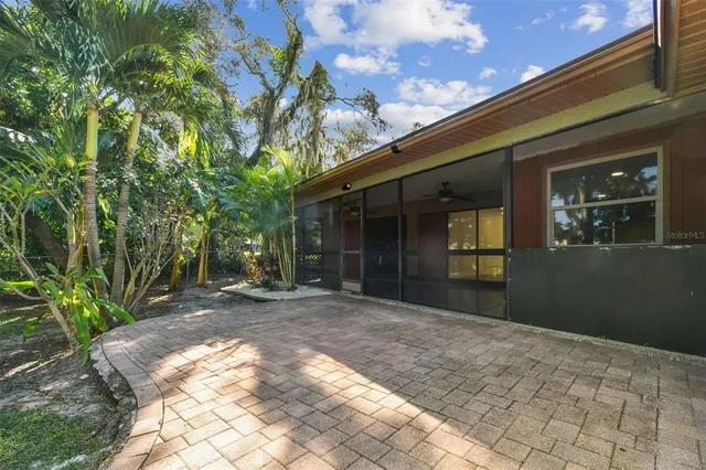 a view of a house with swimming pool and a yard