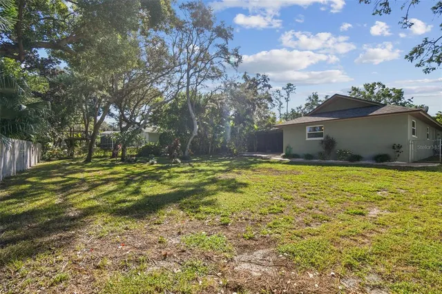 a view of a backyard with green space