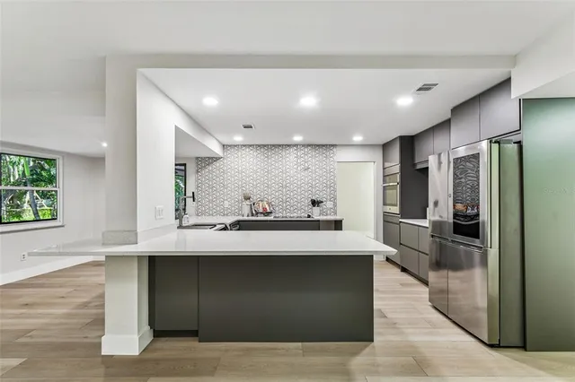 a view of kitchen with cabinets and wooden floor
