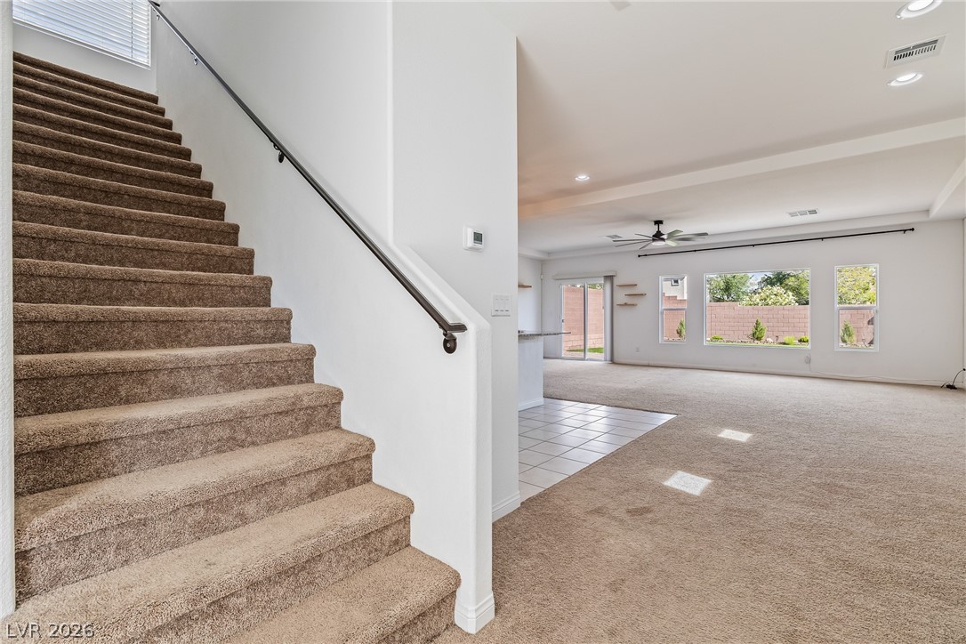 5510 Ripple Ridge Avenue Las Vegas, NV 89139 - Photo 25 of 45 This inviting interior features a broad staircase and an open-concept living space with ample natural light.