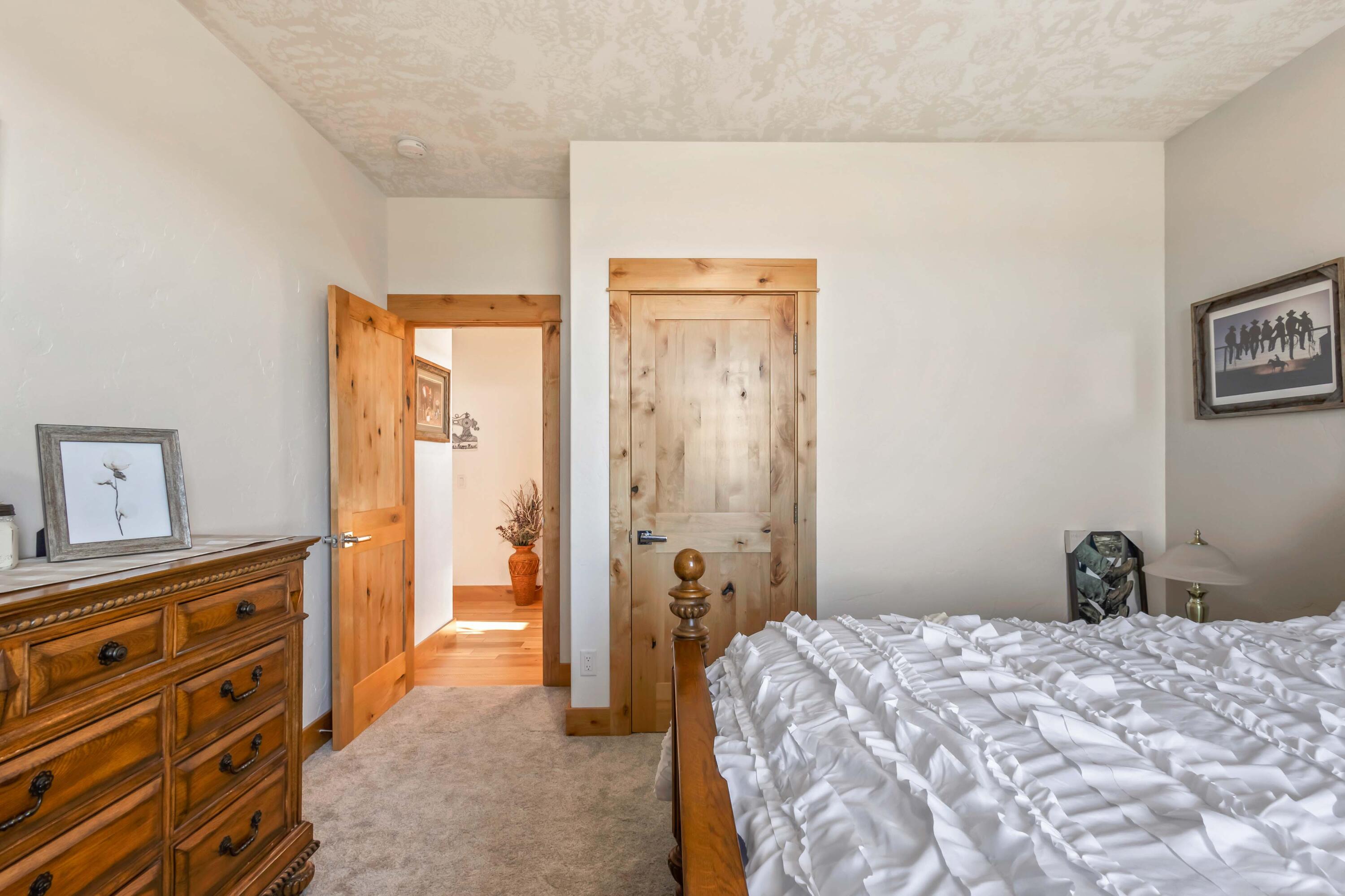 5582 North Mckay Road Prineville, OR 97754 - Photo 26 of 54 a bedroom with a bed and a dresser