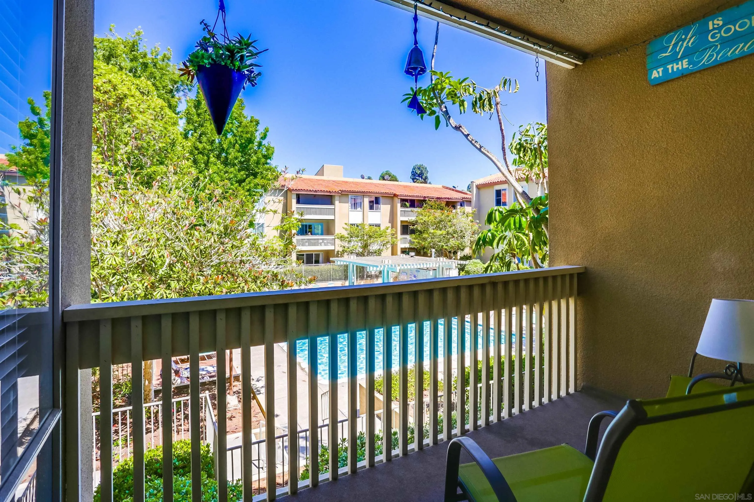 1775 Diamond Street, Unit 220 San Diego, CA 92109 - Photo 17 of 21 a view of a chairs and table in a balcony