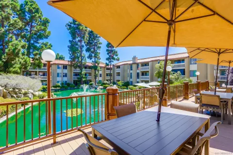 a view of a patio with chairs and wooden floor