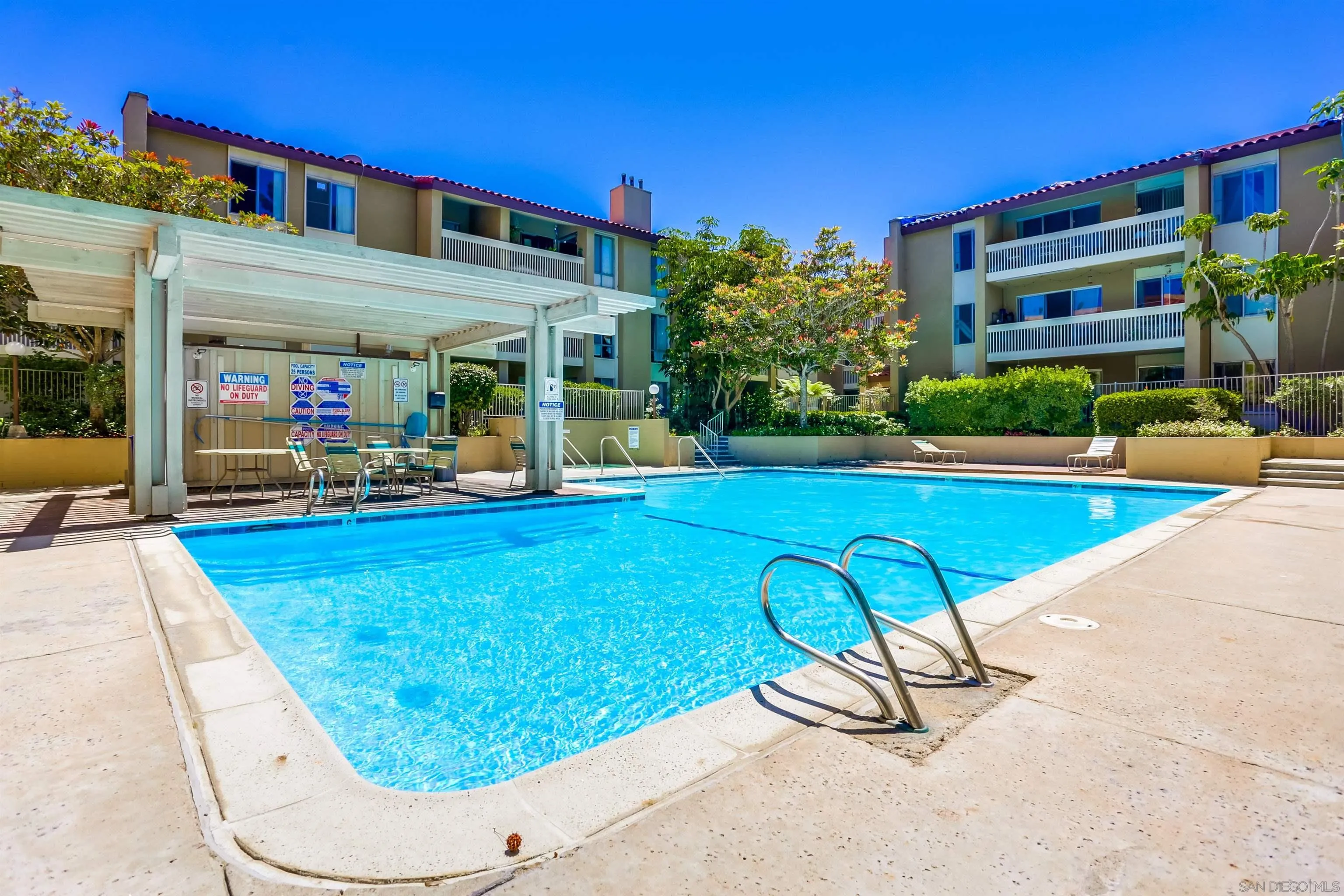 1775 Diamond Street, Unit 220 San Diego, CA 92109 - Photo 21 of 21 a view of a swimming pool with outdoor seating