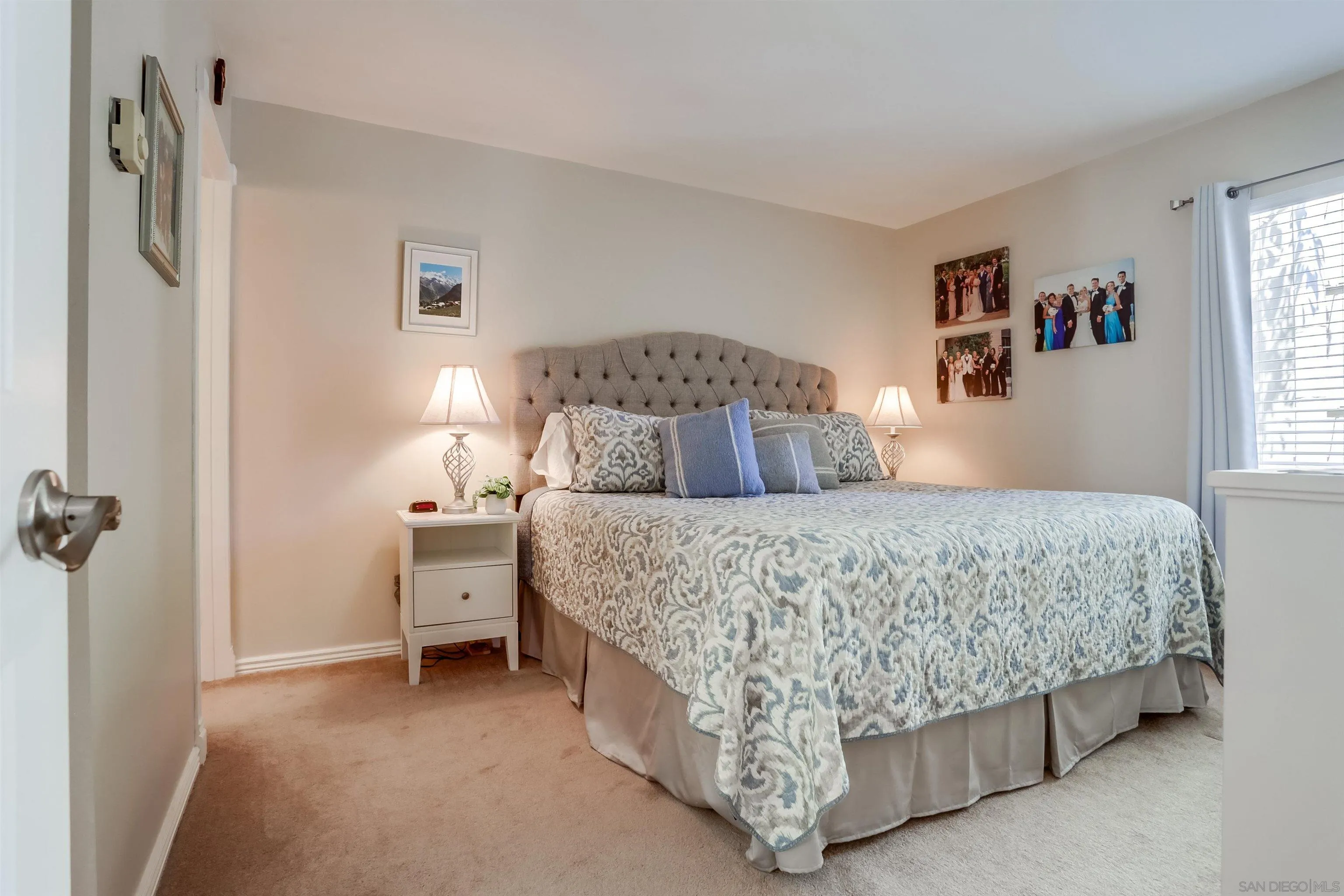 1775 Diamond Street, Unit 220 San Diego, CA 92109 - Photo 9 of 21 a bedroom with a bed and a window