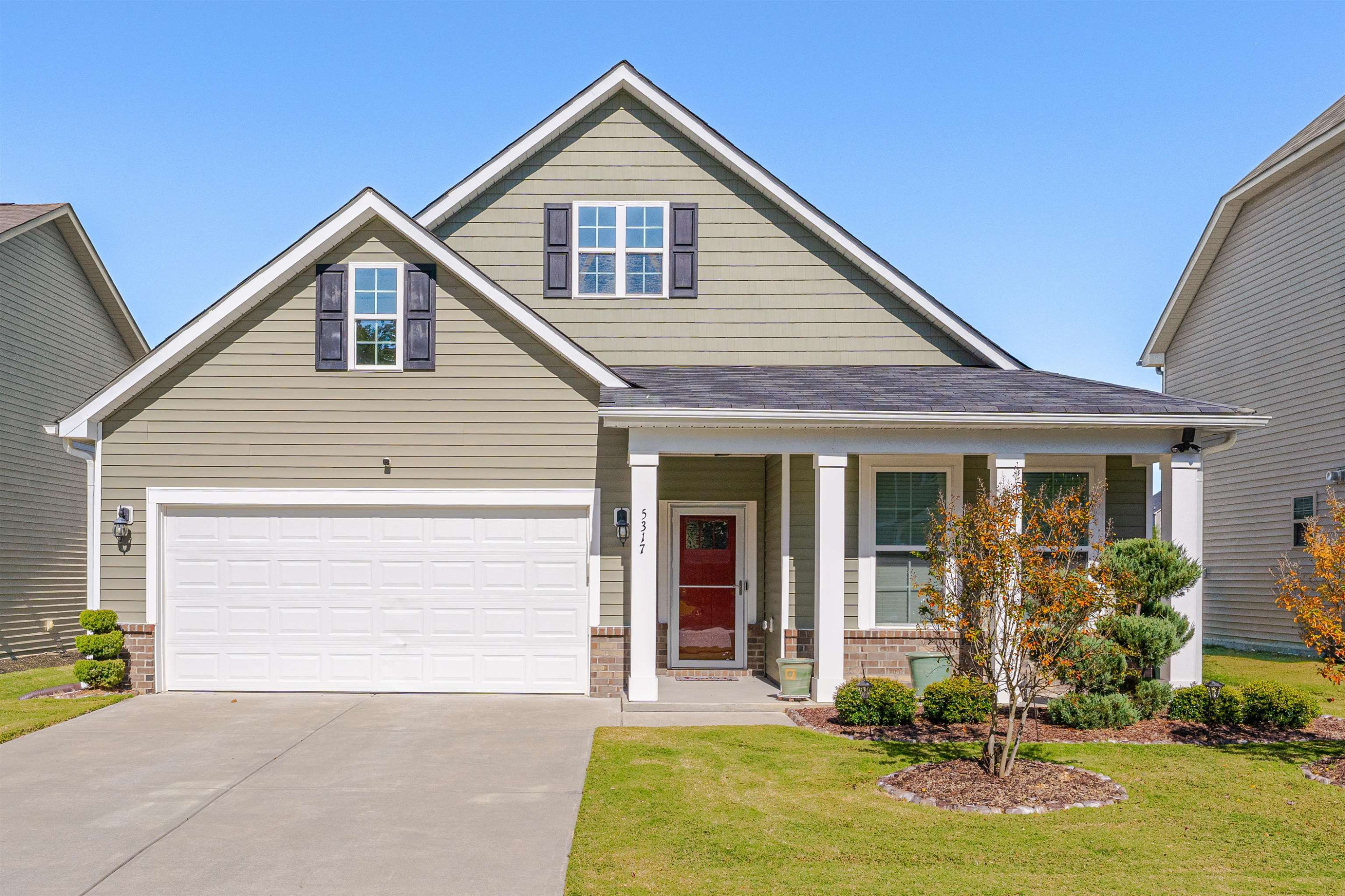 5317 Maplemoor Way Raleigh, NC 27616 - Photo 1 of 25 a front view of a house with a yard