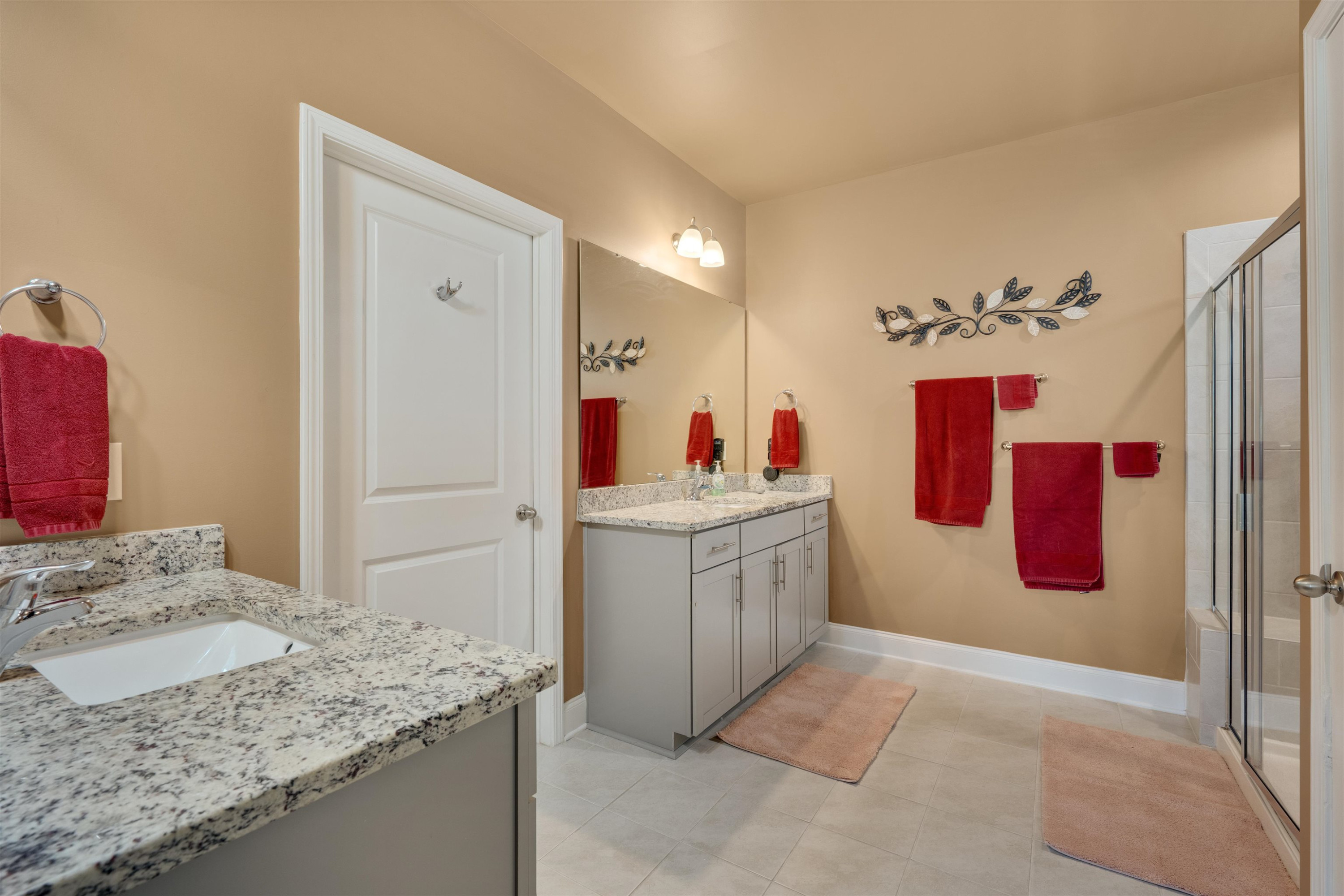 5317 Maplemoor Way Raleigh, NC 27616 - Photo 15 of 25 a bathroom with a granite countertop sink and a mirror