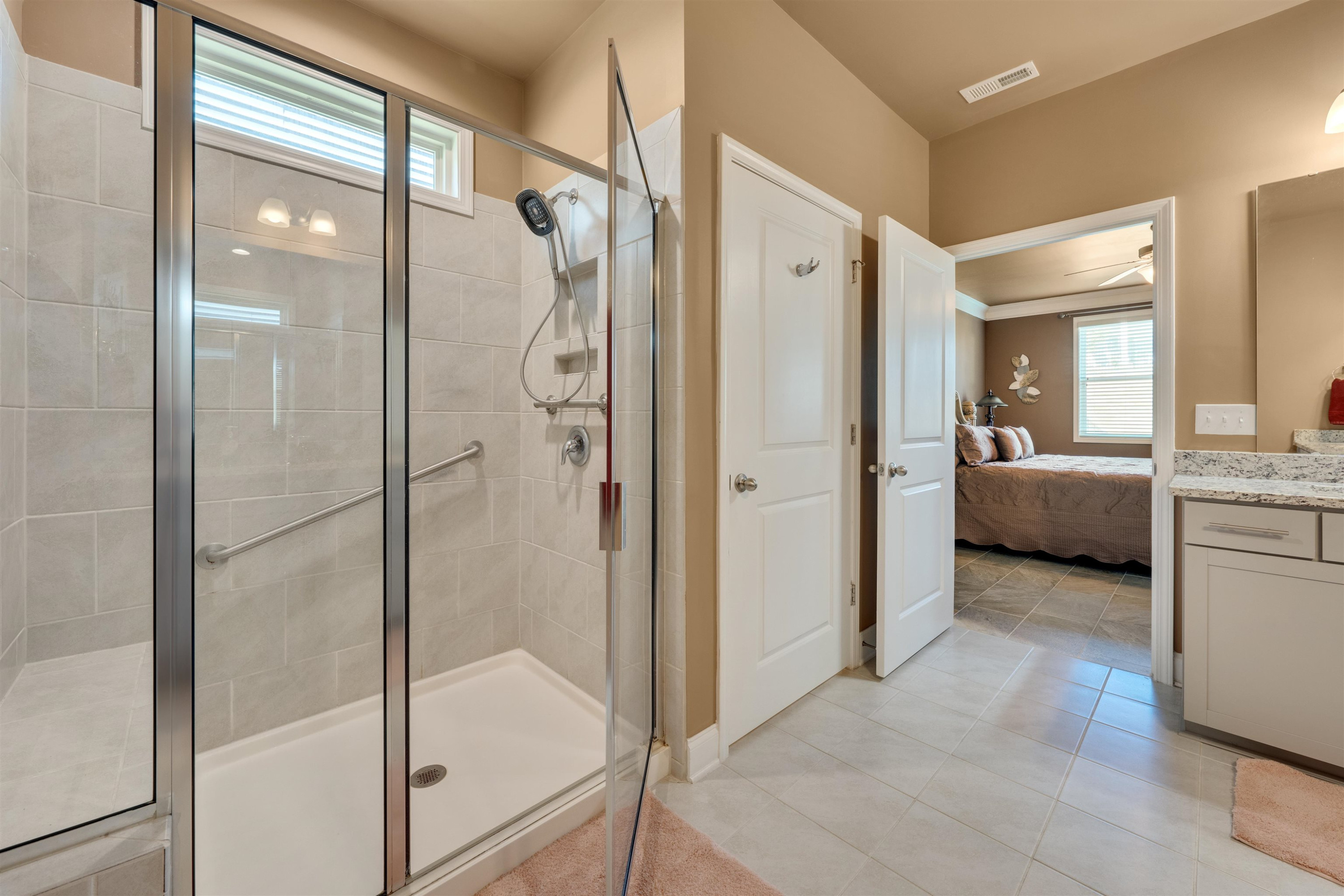 5317 Maplemoor Way Raleigh, NC 27616 - Photo 16 of 25 a bathroom with a tub shower and sink