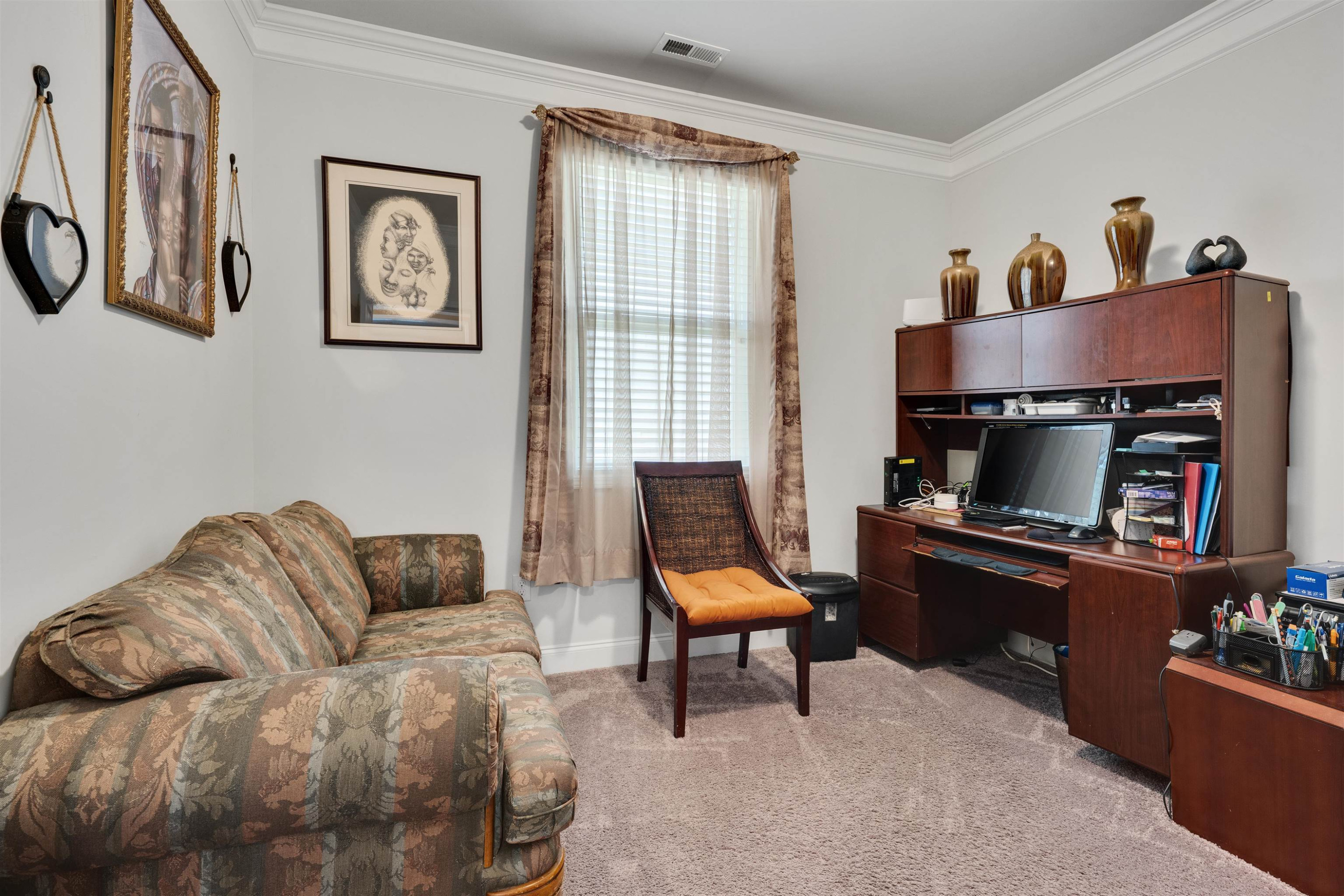 5317 Maplemoor Way Raleigh, NC 27616 - Photo 17 of 25 a living room with furniture and a window