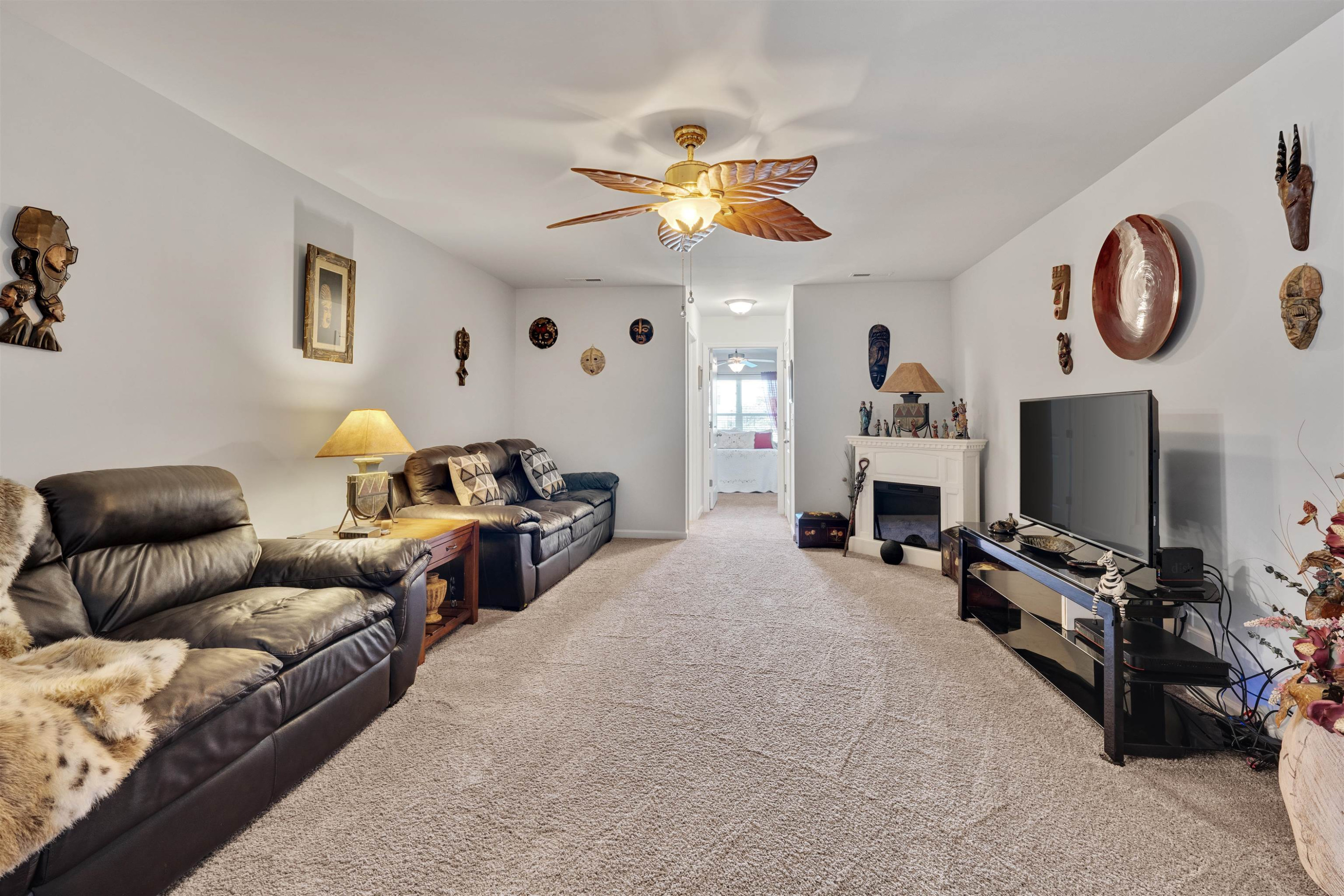 5317 Maplemoor Way Raleigh, NC 27616 - Photo 19 of 25 a bedroom with furniture and a flat screen tv