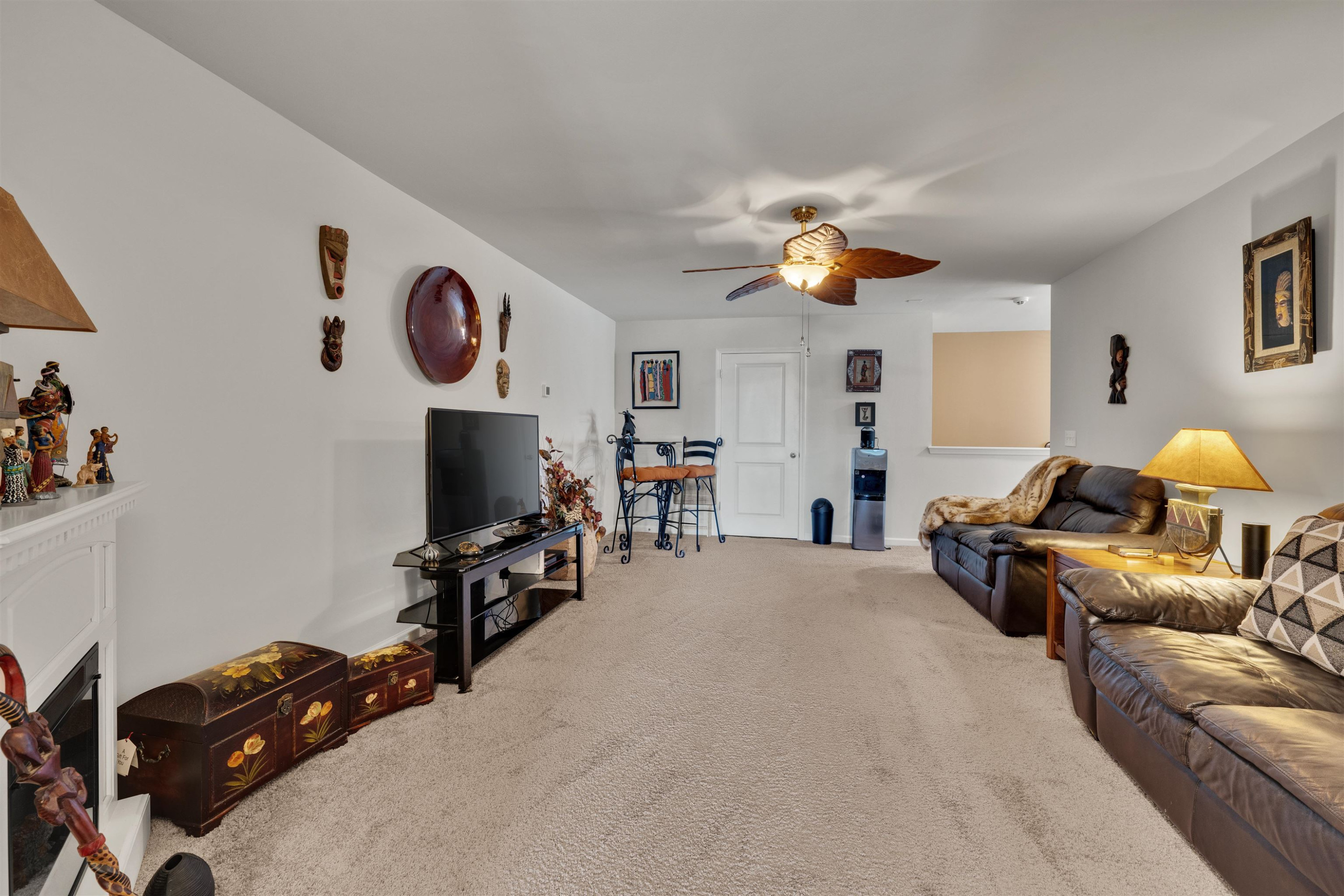 5317 Maplemoor Way Raleigh, NC 27616 - Photo 20 of 25 a living room with furniture gym equipment and a chandelier