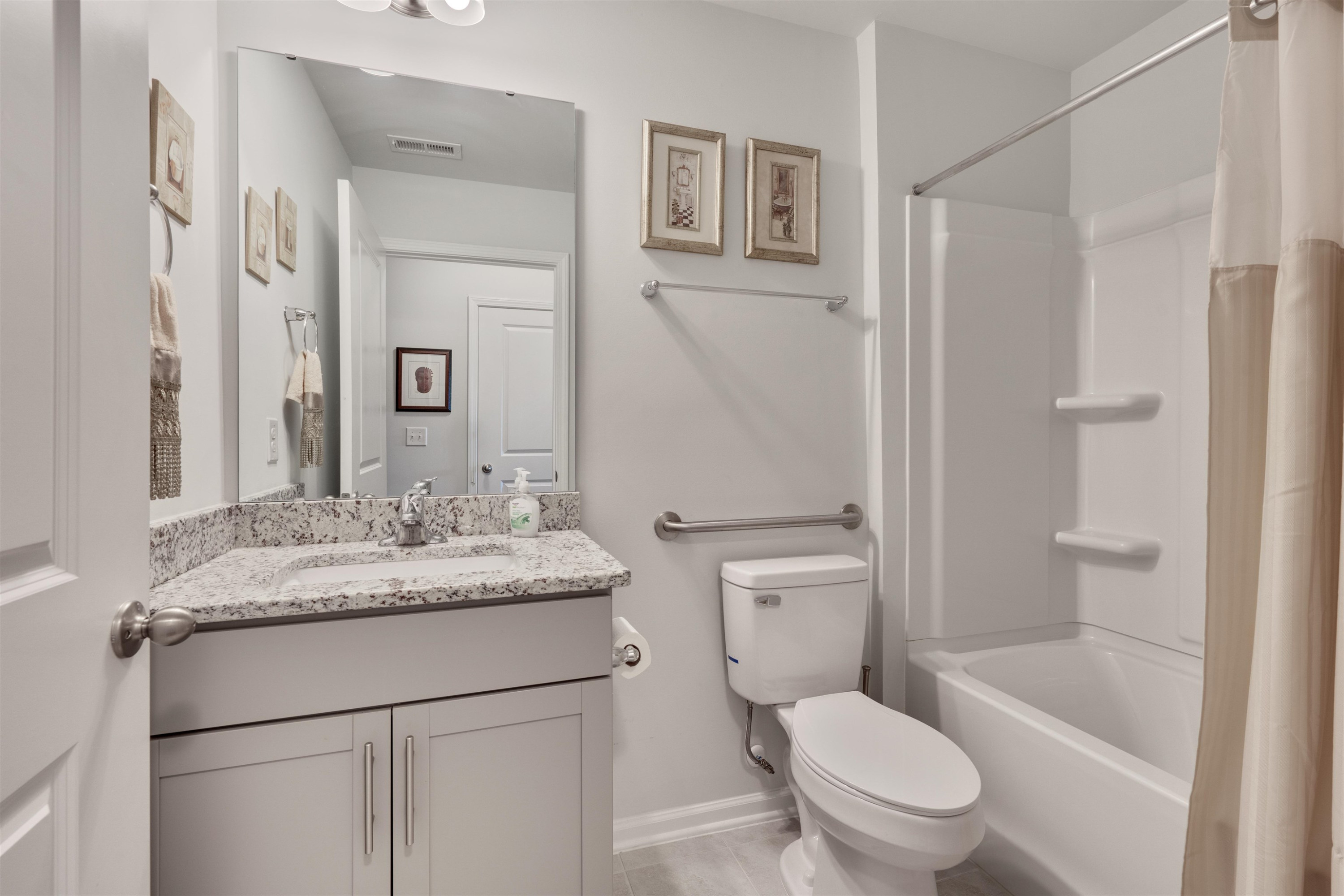 5317 Maplemoor Way Raleigh, NC 27616 - Photo 21 of 25 a bathroom with a granite countertop toilet sink and a mirror