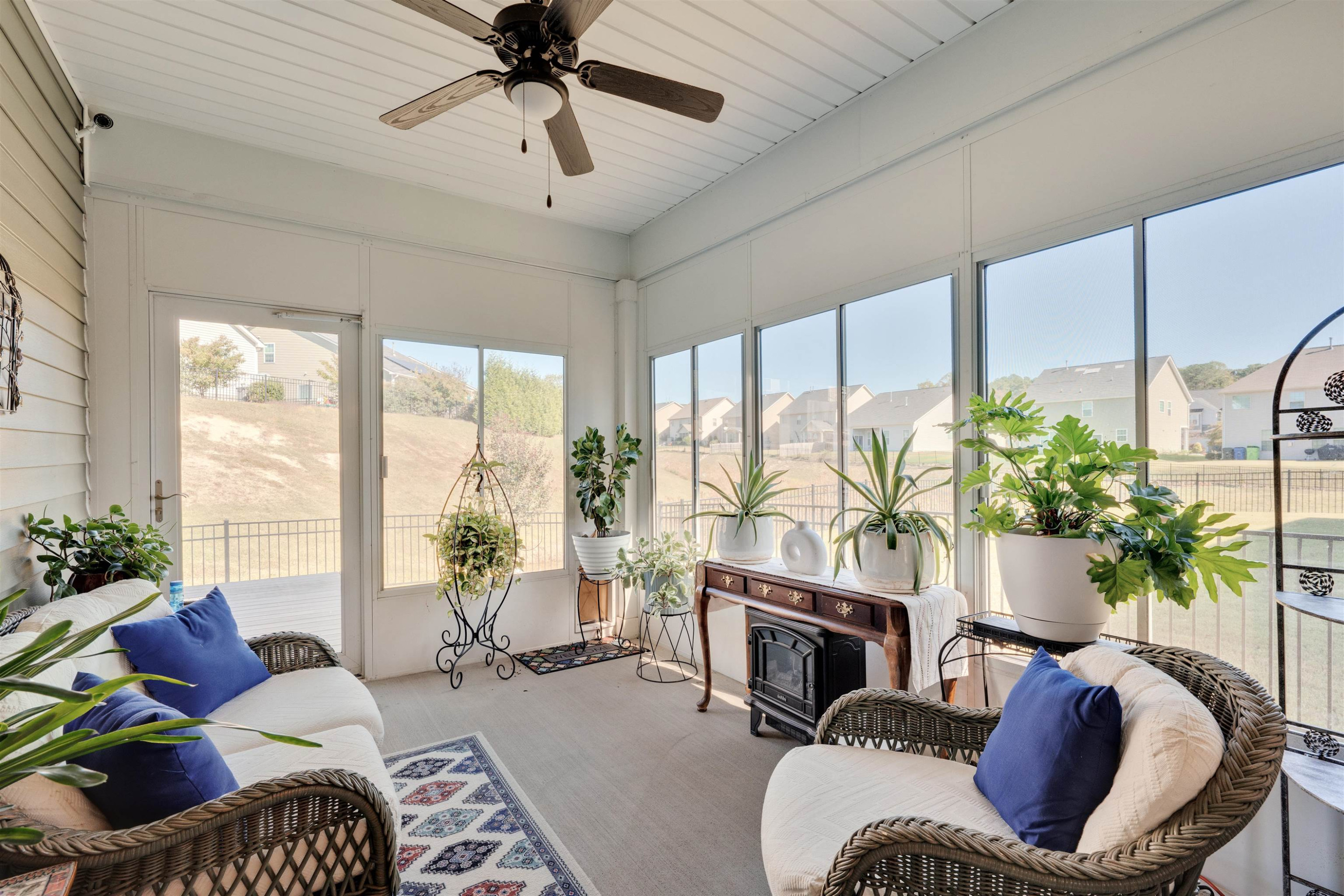 5317 Maplemoor Way Raleigh, NC 27616 - Photo 23 of 25 a living room with furniture fireplace and a large window