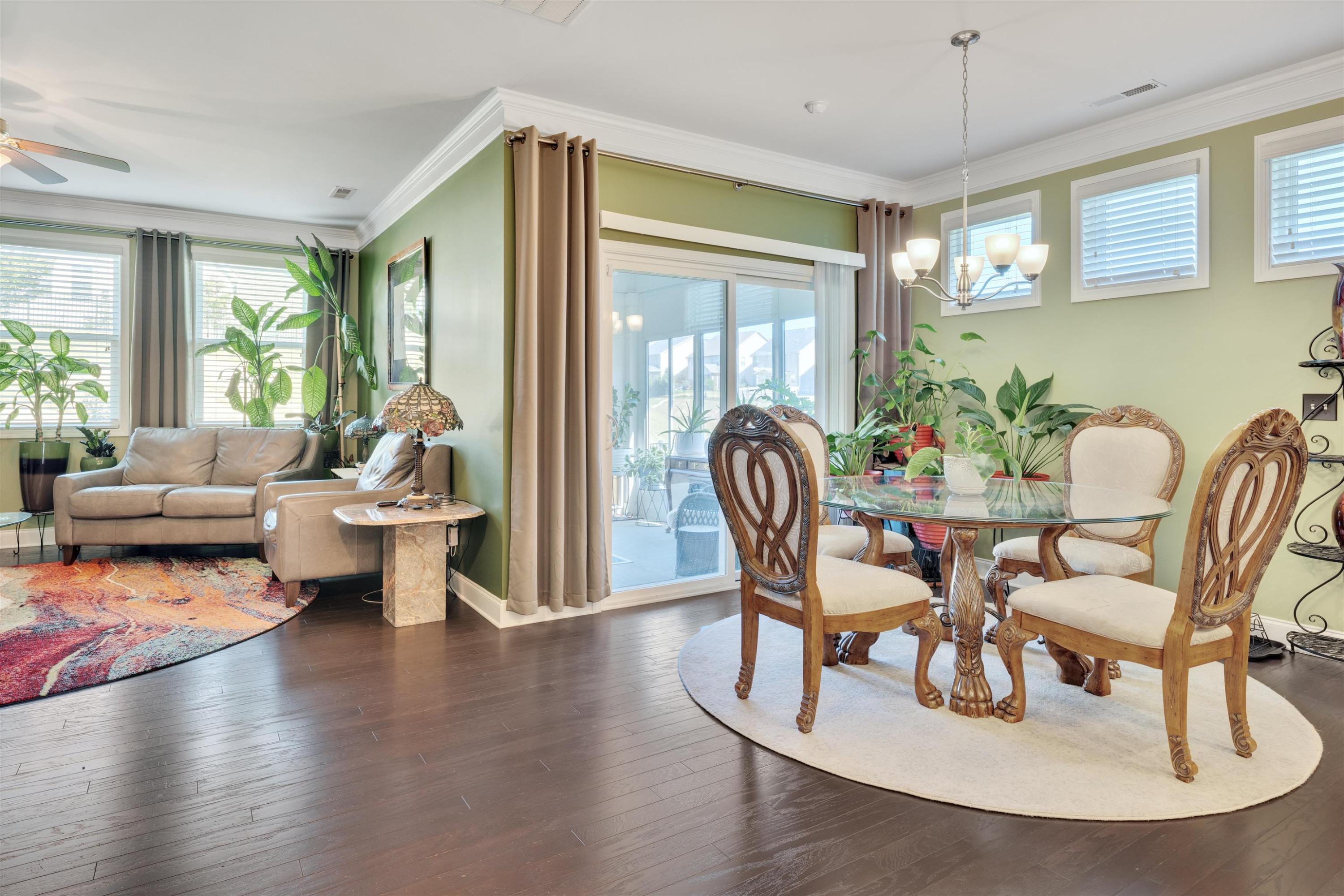 5317 Maplemoor Way Raleigh, NC 27616 - Photo 10 of 25 a living room with furniture wooden floor and a chandelier