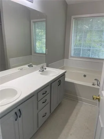 a bathroom with a sink and a bathtub