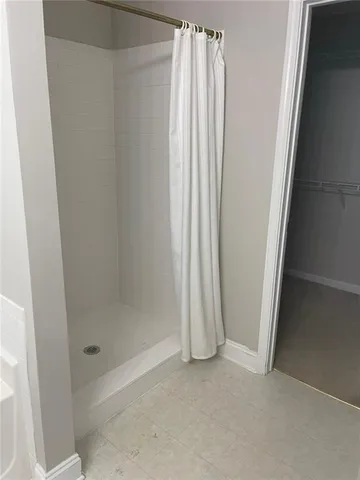 a bathroom with a shower and a tub