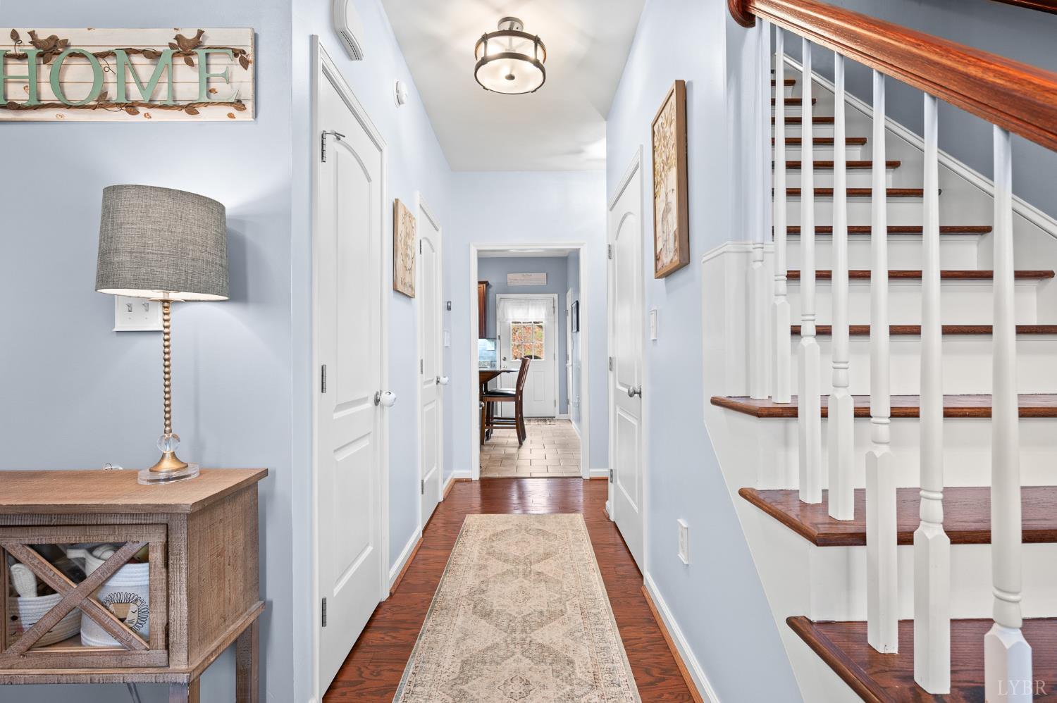 614 Carriage Parkway Rustburg, VA 24588 - Photo 19 of 44 a view of a hallway with wooden floor and workspace