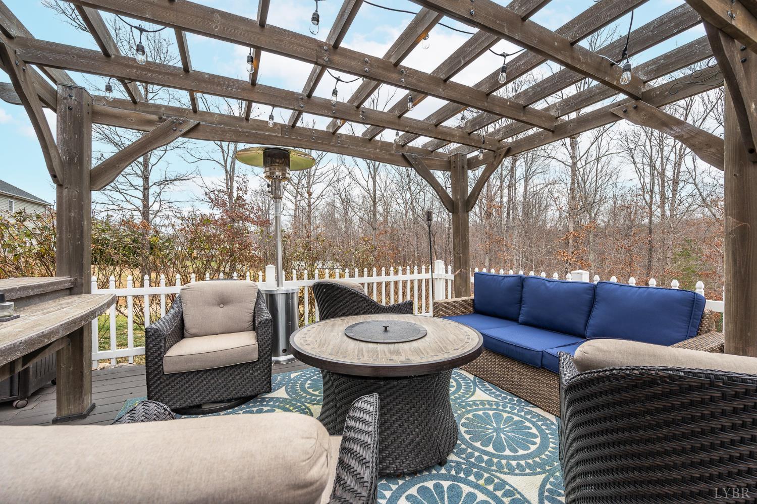 614 Carriage Parkway Rustburg, VA 24588 - Photo 40 of 44 a living room with a couch and a chandelier