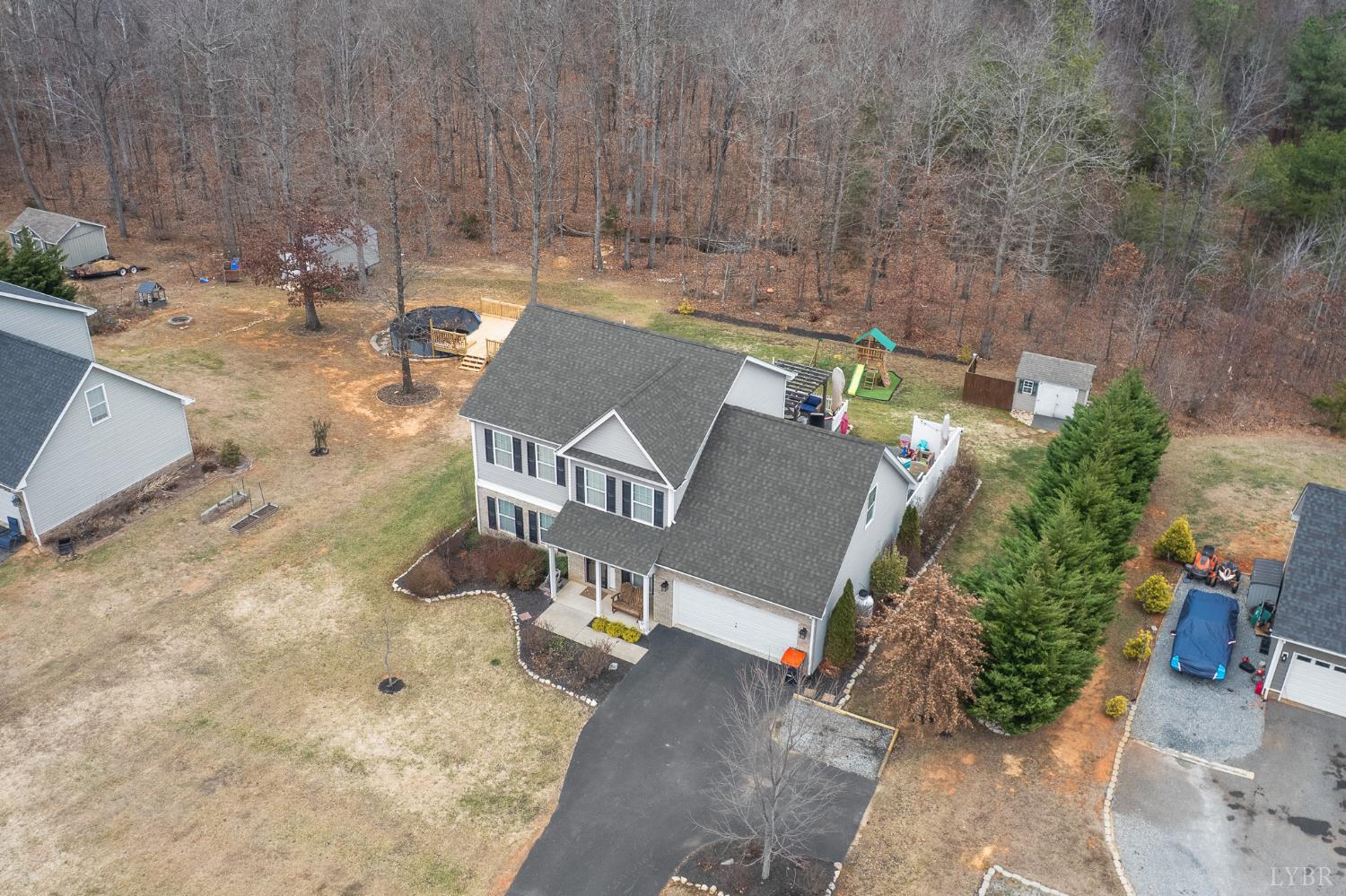 614 Carriage Parkway Rustburg, VA 24588 - Photo 6 of 44 an aerial view of a house with yard and greenery