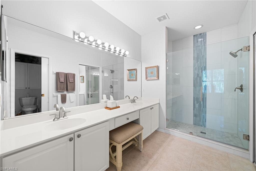 23785 Clear Spring Court, Unit 2305 Estero, FL 34135 - Photo 15 of 30 a bathroom with a double vanity sink mirror and double