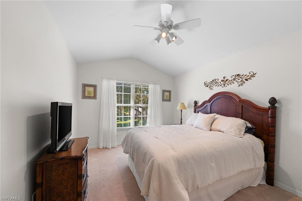 23785 Clear Spring Court, Unit 2305 Estero, FL 34135 - Photo 16 of 30 a bedroom with a bed tv and a window