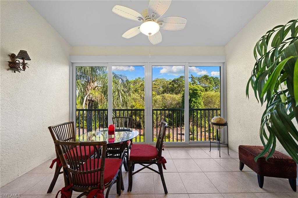 23785 Clear Spring Court, Unit 2305 Estero, FL 34135 - Photo 20 of 30 a view of a dining room with furniture window and outside view