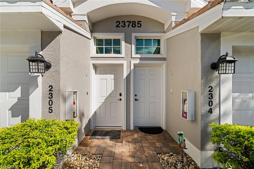 23785 Clear Spring Court, Unit 2305 Estero, FL 34135 - Photo 2 of 30 a view of a front door of the house