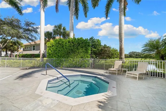 a view of a swimming pool with a patio and a garden