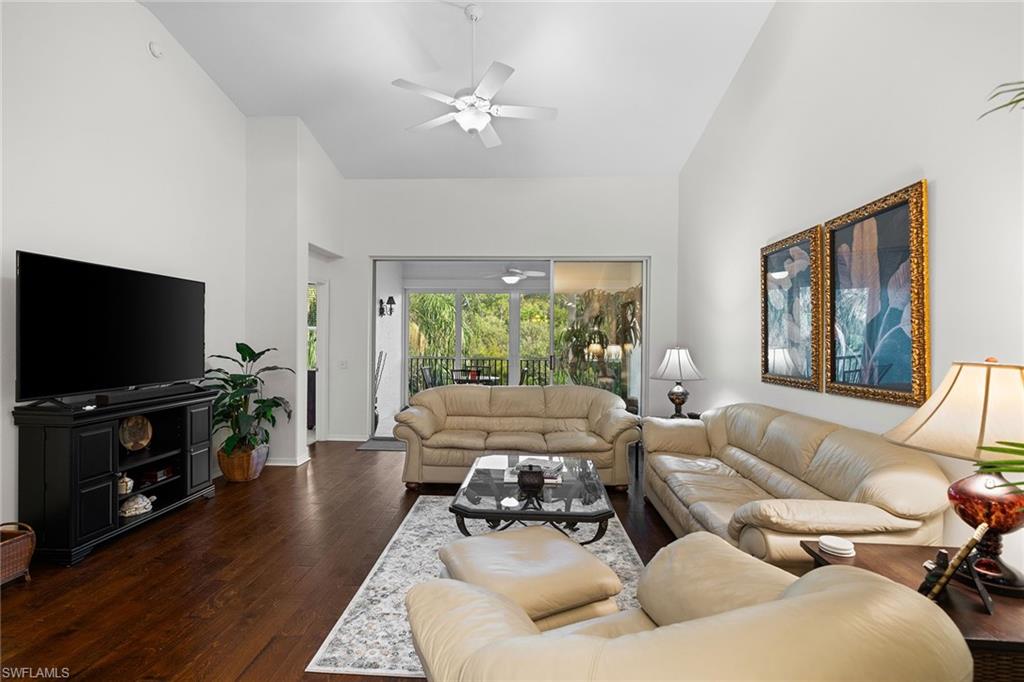 23785 Clear Spring Court, Unit 2305 Estero, FL 34135 - Photo 5 of 30 a living room with furniture and a flat screen tv