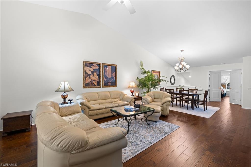 23785 Clear Spring Court, Unit 2305 Estero, FL 34135 - Photo 6 of 30 a living room with furniture and wooden floor