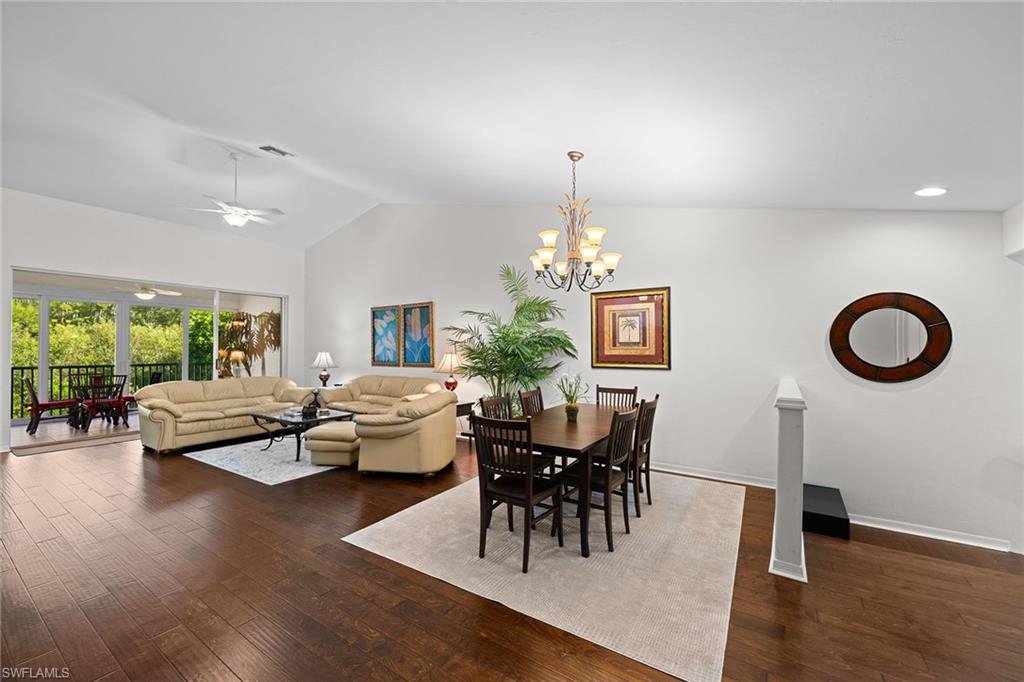 23785 Clear Spring Court, Unit 2305 Estero, FL 34135 - Photo 8 of 30 a living room with furniture and a wooden floor