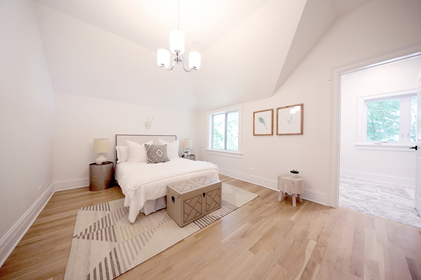 148 Barrypoint Road Riverside, IL 60546 - Photo 27 of 30 a spacious bedroom with a bed and a wooden floor