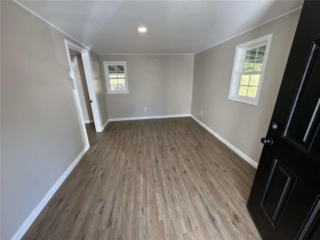a view of empty room with windows
