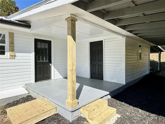 a view of entryway with wooden floor