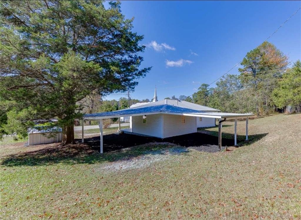 5554 Yonah Homer Road Alto, GA 30510 - Photo 24 of 25 a roof deck with a table and a chair
