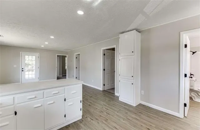 a kitchen with a stove a sink and a refrigerator