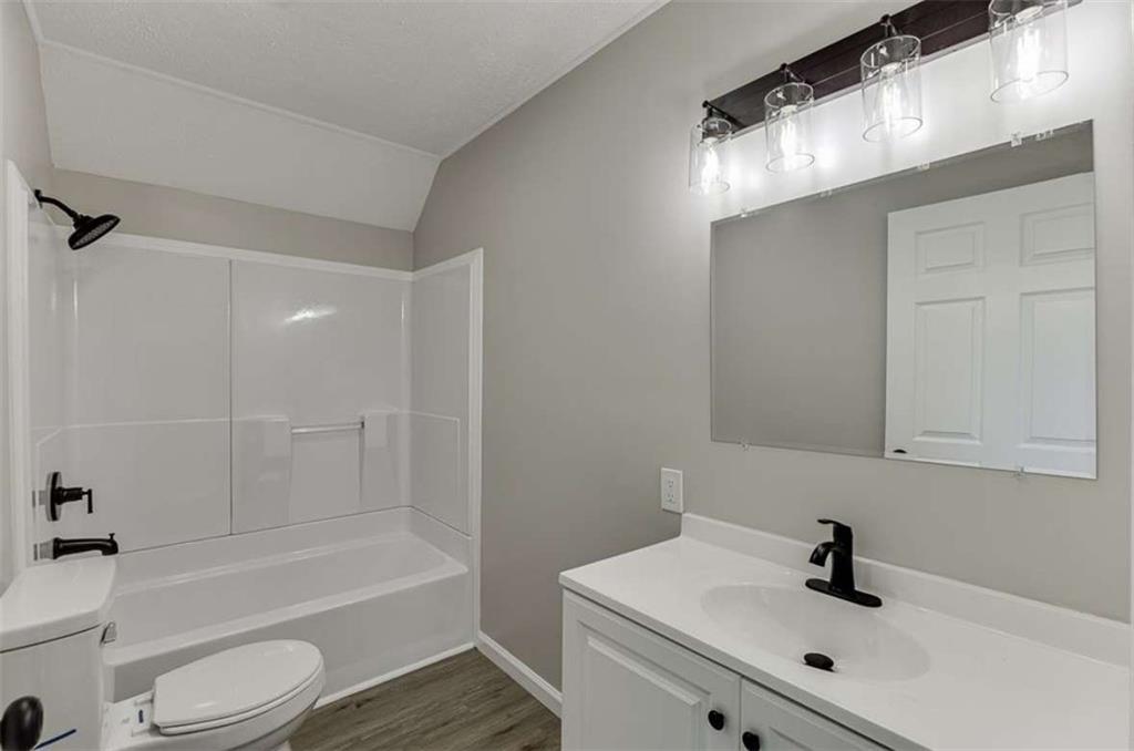 5554 Yonah Homer Road Alto, GA 30510 - Photo 9 of 25 a bathroom with a sink a toilet and shower