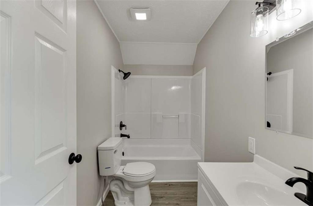 5554 Yonah Homer Road Alto, GA 30510 - Photo 10 of 25 a bathroom with a sink mirror toilet and bathtub