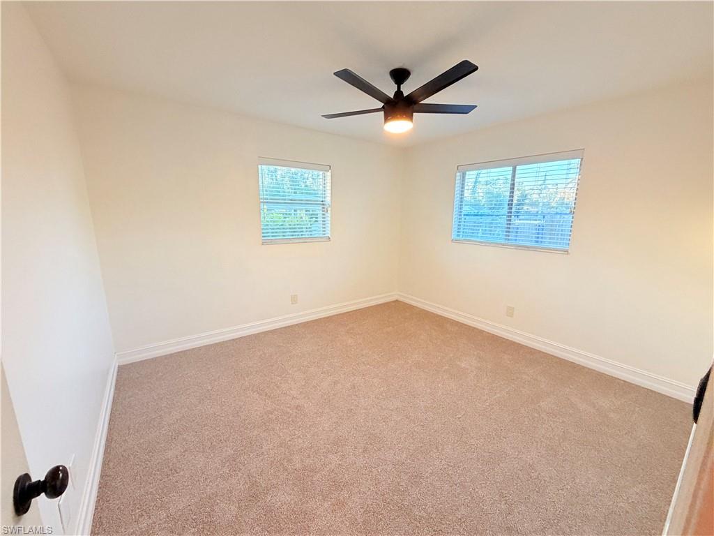 9017 Pineapple Road Fort Myers, FL 33967 - Photo 12 of 24 Carpeted spare room with plenty of natural light