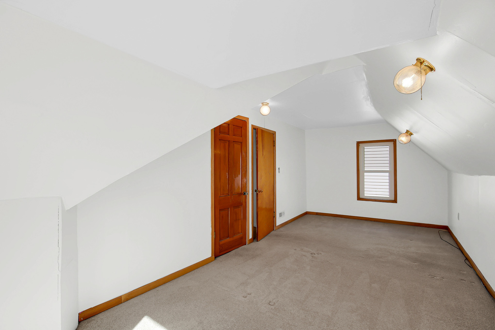 10922 South Ave B Chicago, IL 60617 - Photo 16 of 24 an empty room with window and flowerpot