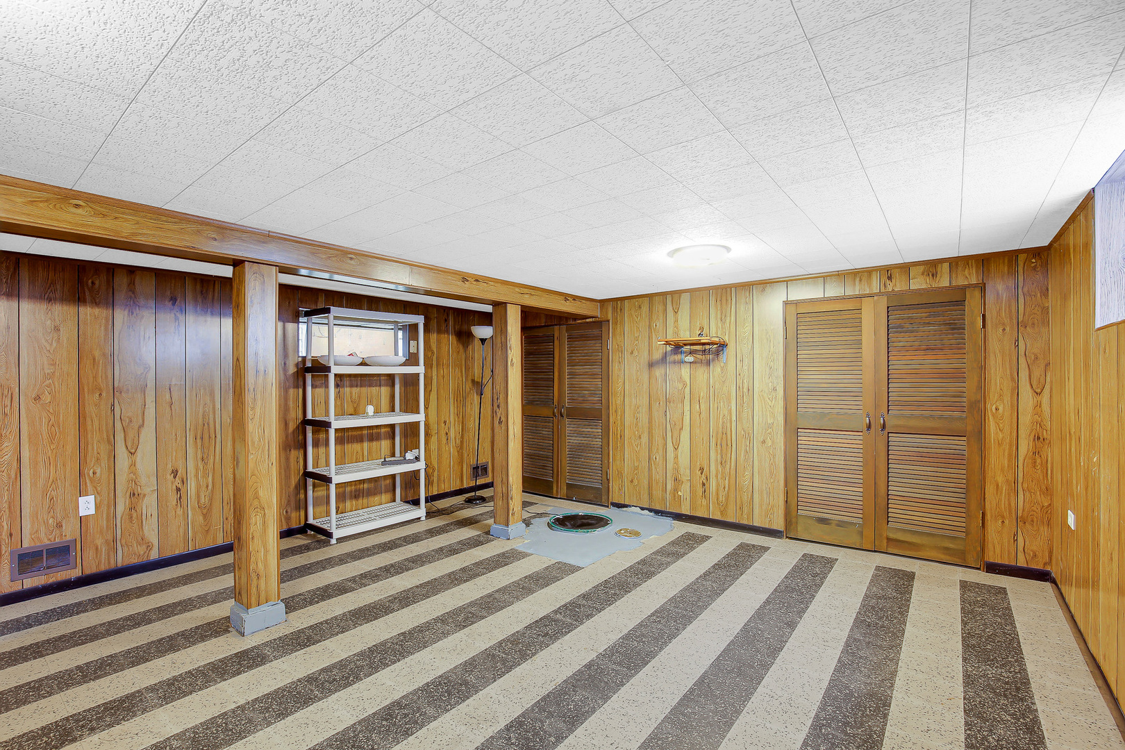 10922 South Ave B Chicago, IL 60617 - Photo 19 of 24 a view of a livingroom with wooden shelves