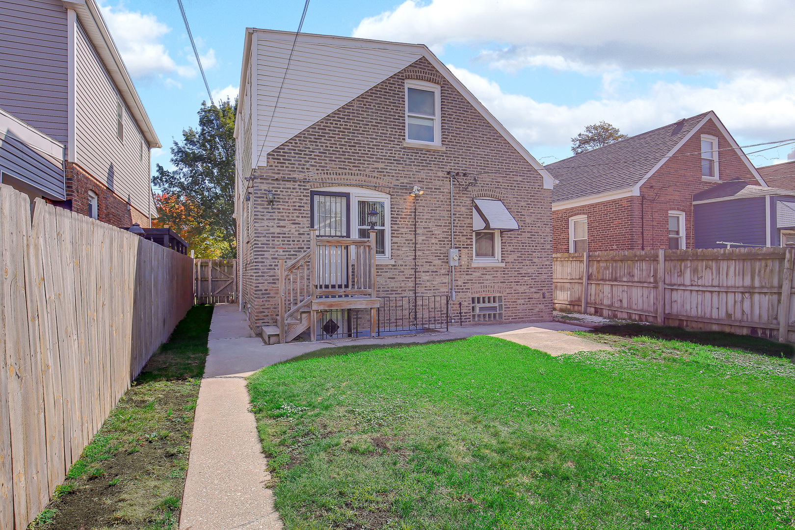 10922 South Ave B Chicago, IL 60617 - Photo 24 of 24 a aerial view of a house next to a big yard and wooden fence