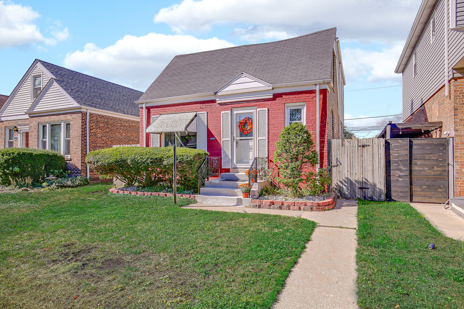 10922 South Ave B Chicago, IL 60617 - Photo 3 of 24 a front view of house with yard and green space